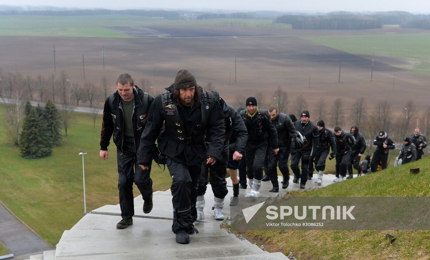 Night Wolves motorcycle club members lay flowers at the Mound of Glory in Minsk