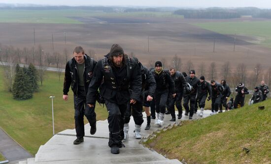 Night Wolves motorcycle club members lay flowers at the Mound of Glory in Minsk