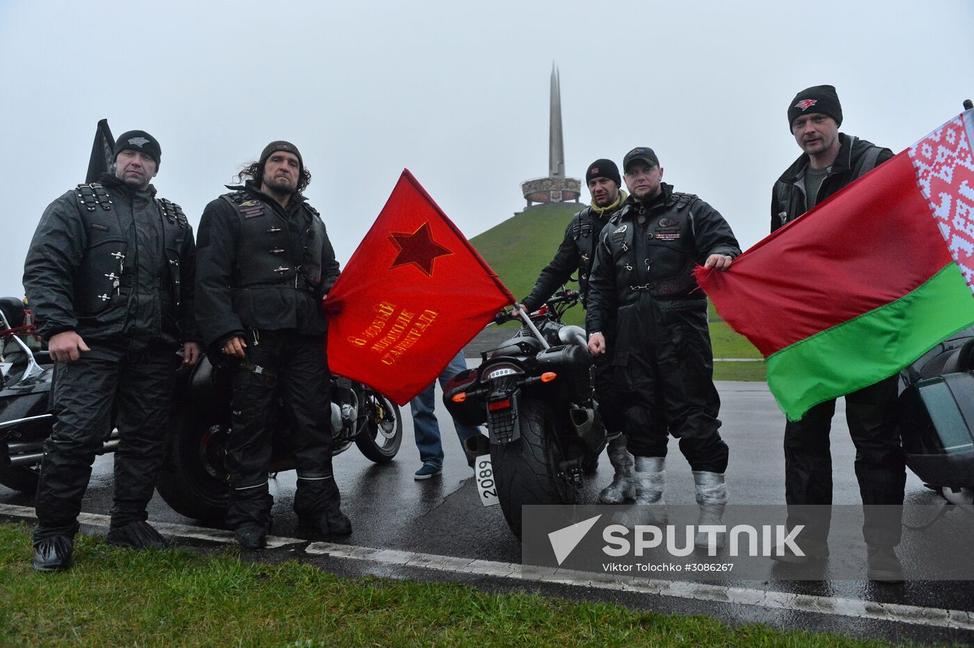 Night Wolves motorcycle club members lay flowers at the Mound of Glory in Minsk
