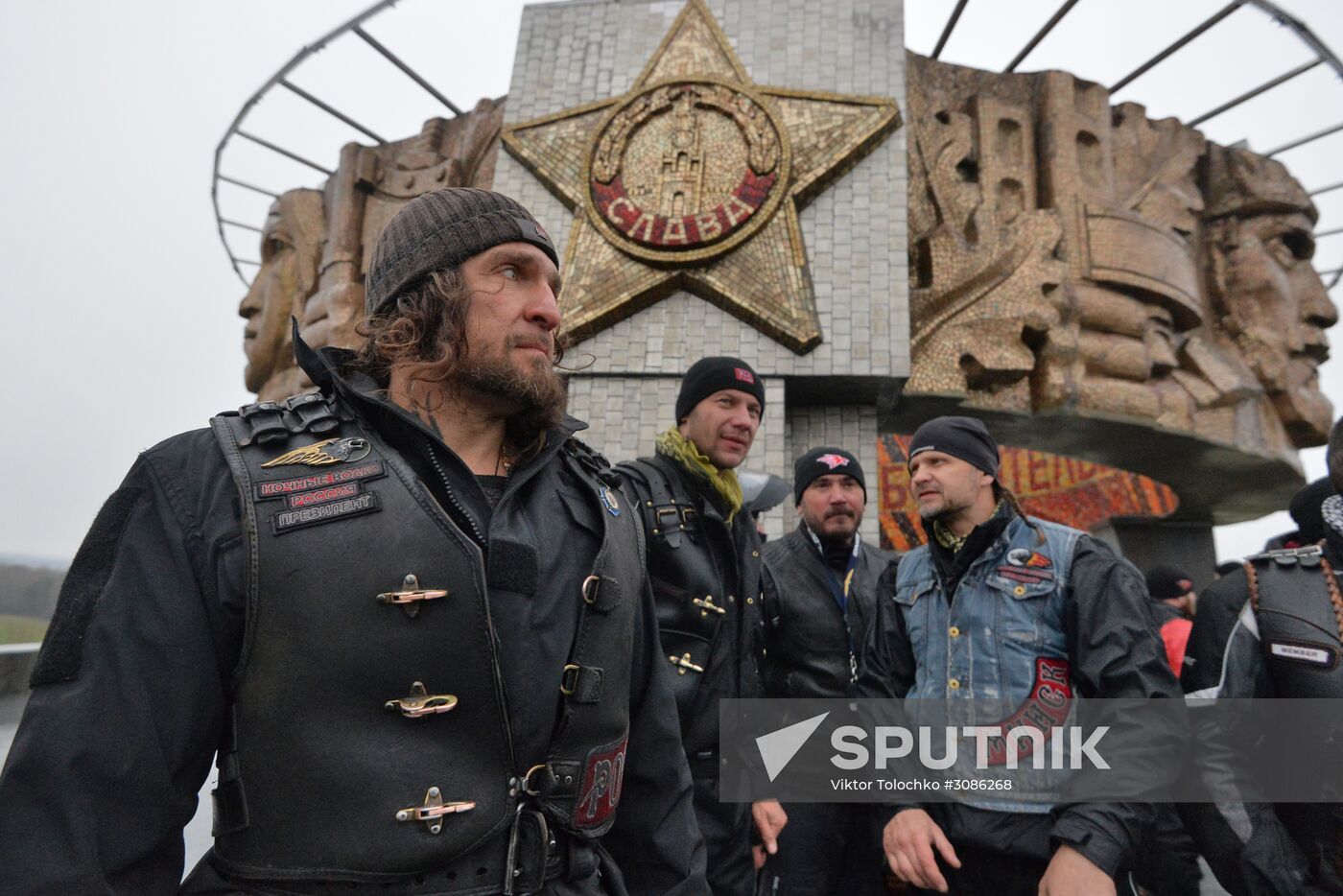 Night Wolves motorcycle club members lay flowers at the Mound of Glory in Minsk