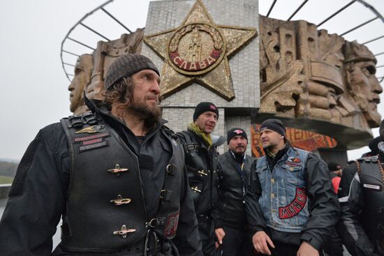 Night Wolves motorcycle club members lay flowers at the Mound of Glory in Minsk
