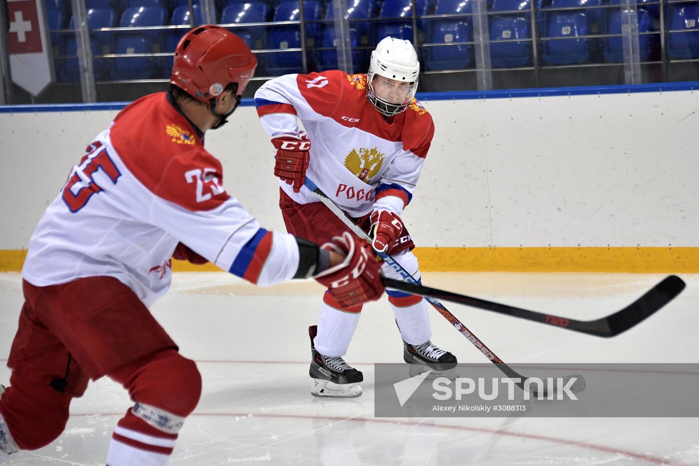 President Vladimir Putin takes part in hockey training session in Sochi