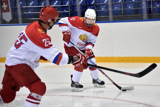 President Vladimir Putin takes part in hockey training session in Sochi