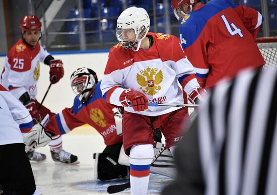 President Vladimir Putin takes part in hockey training session in Sochi