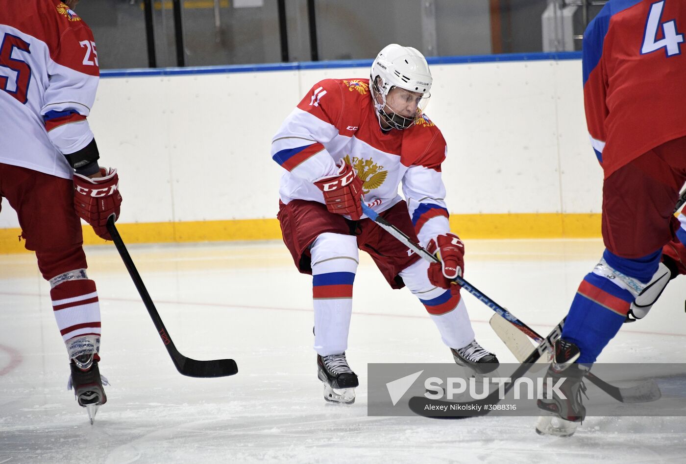 President Vladimir Putin takes part in hockey training session in Sochi