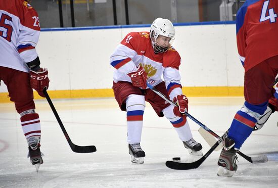 President Vladimir Putin takes part in hockey training session in Sochi