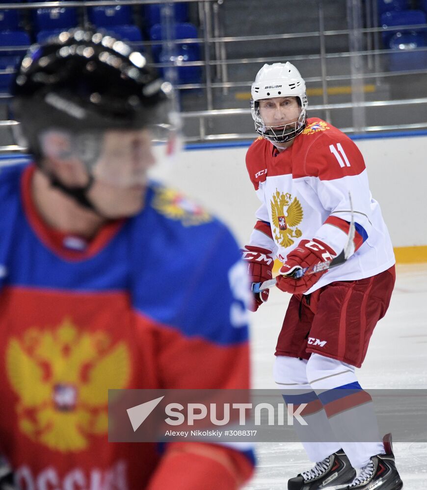 President Vladimir Putin takes part in hockey training session in Sochi