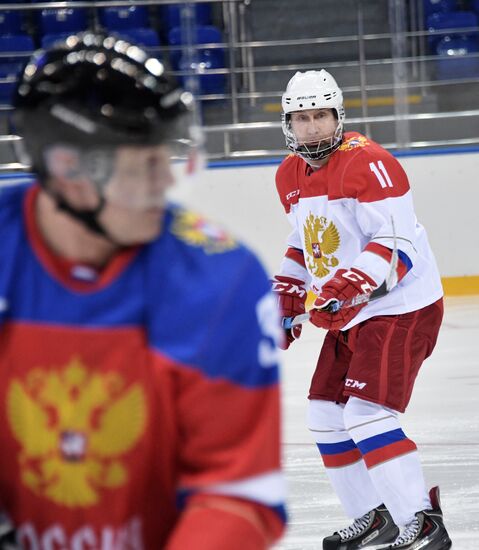 President Vladimir Putin takes part in hockey training session in Sochi