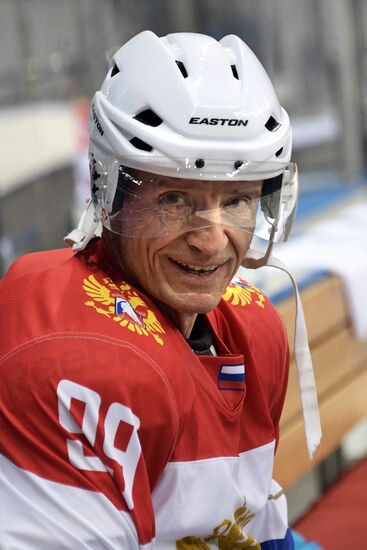 President Vladimir Putin takes part in hockey training session in Sochi