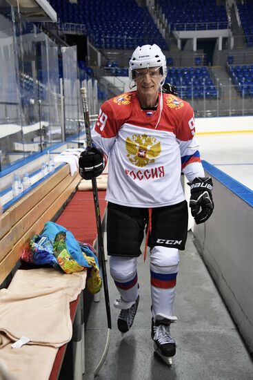 President Vladimir Putin takes part in hockey training session in Sochi