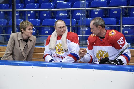 President Vladimir Putin takes part in hockey training session in Sochi