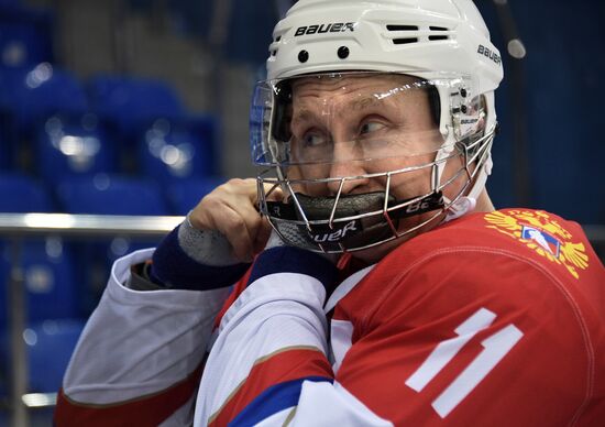 President Vladimir Putin takes part in hockey training session in Sochi