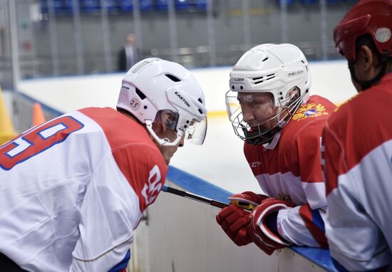 President Vladimir Putin takes part in hockey training session in Sochi