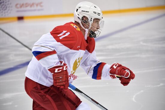 President Vladimir Putin takes part in hockey training session in Sochi