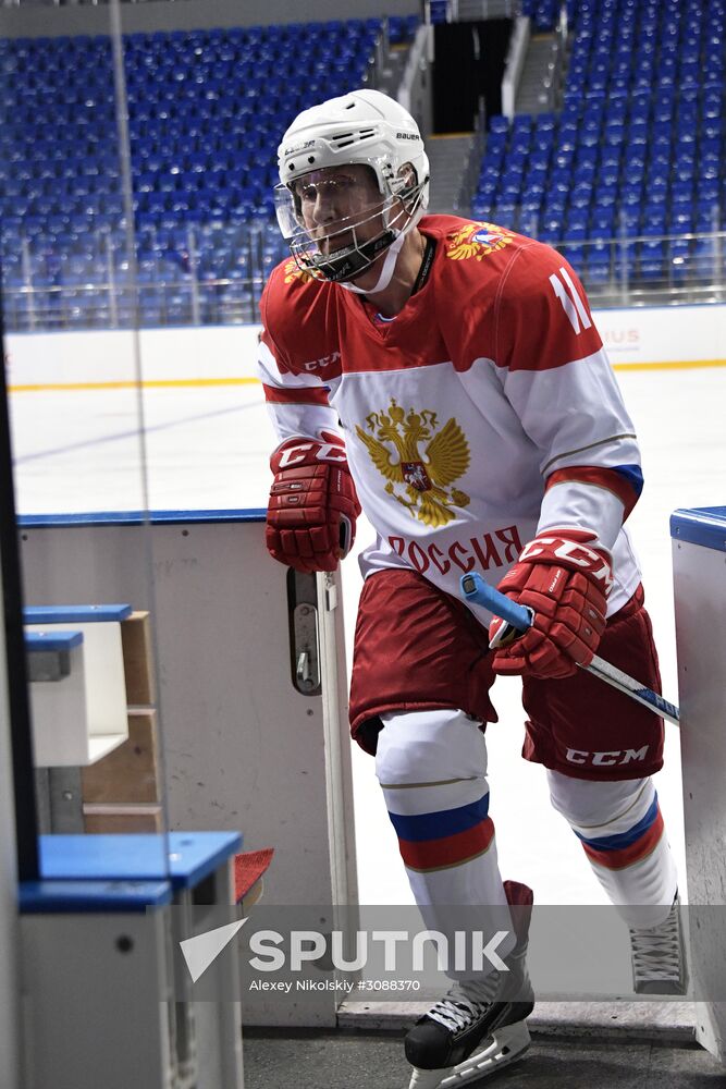 President Vladimir Putin takes part in hockey training session in Sochi
