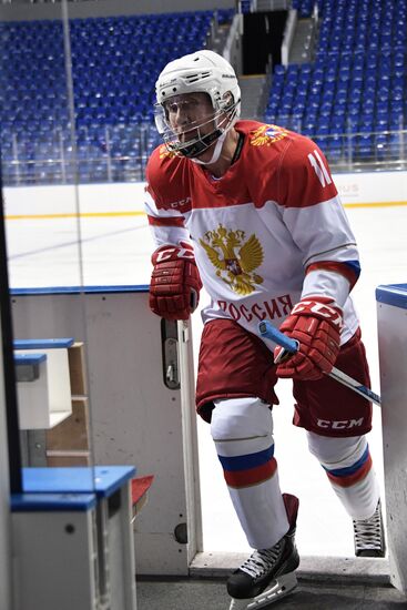 President Vladimir Putin takes part in hockey training session in Sochi