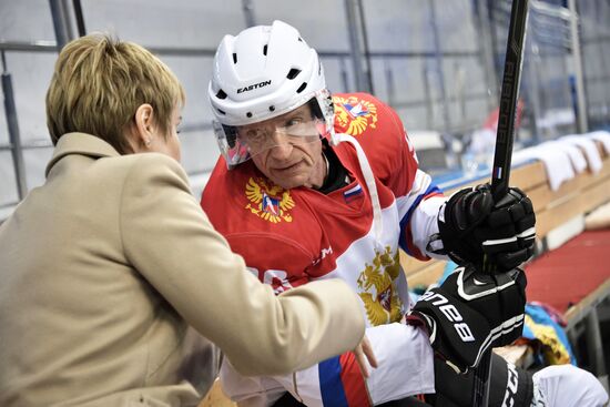 President Vladimir Putin takes part in hockey training session in Sochi