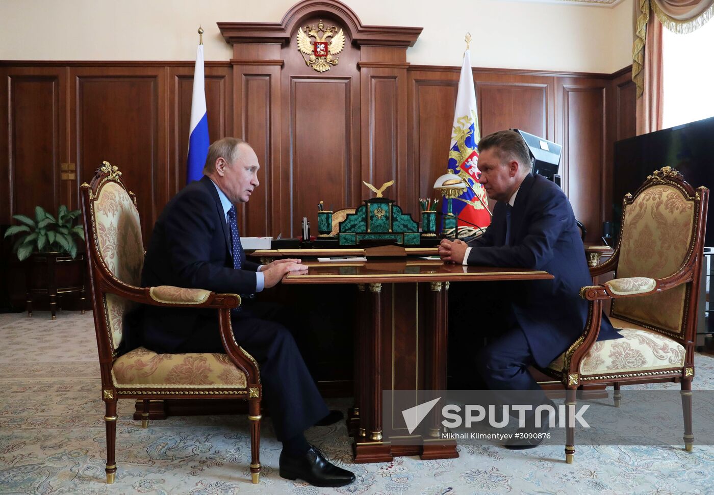 Russian President Vladimir Putin meets with Gazprom CEO Alexei Miller