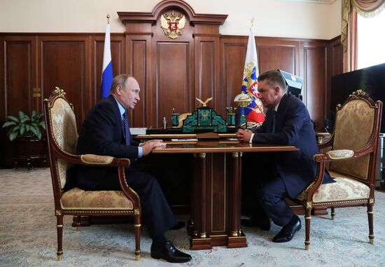 Russian President Vladimir Putin meets with Gazprom CEO Alexei Miller
