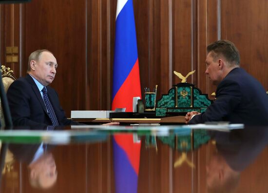 Russian President Vladimir Putin meets with Gazprom CEO Alexei Miller