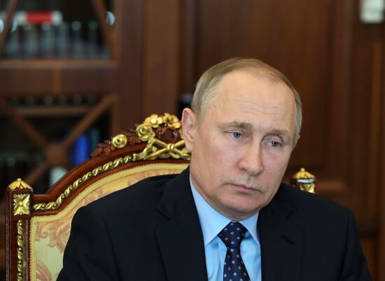 Russian President Vladimir Putin meets with Gazprom CEO Alexei Miller