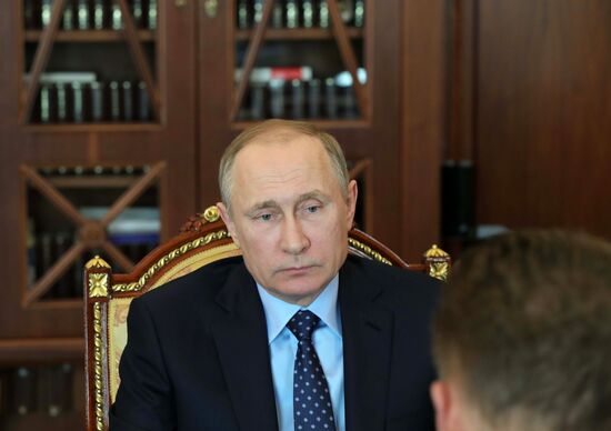 Russian President Vladimir Putin meets with Gazprom CEO Alexei Miller