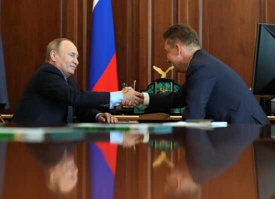 Russian President Vladimir Putin meets with Gazprom CEO Alexei Miller