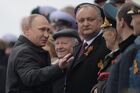 May 9, 2017. Russian President Vladimir Putin and Moldovan President Igor Dodon during the military parade marking the 72nd anniversary of Victory in the 1941-45 Great Patriotic War on Red Square, Moscow. Location: Russia, Moscow. Author: Grigory Sysoev/Sputnik. President Putin, Prime Minister Medvedev attend military parade on 72nd anniversary of victory in Great Patriotic War