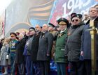 May 9, 2017. Russian President Vladimir Putin, Supreme Commander-in-Chief of the Russian Armed Forces, and Moldovan President Igor Dodon, center left, and Russian Prime Minister Dmitry Medvedev during the military parade marking the 72nd anniversary of Victory in the 1941-45 Great Patriotic War. Location: Russia, Moscow. Author: Mikhail Klimentyev/Sputnik. President Putin, Prime Minister Medvedev attend military parade on 72nd anniversary of victory in Great Patriotic War