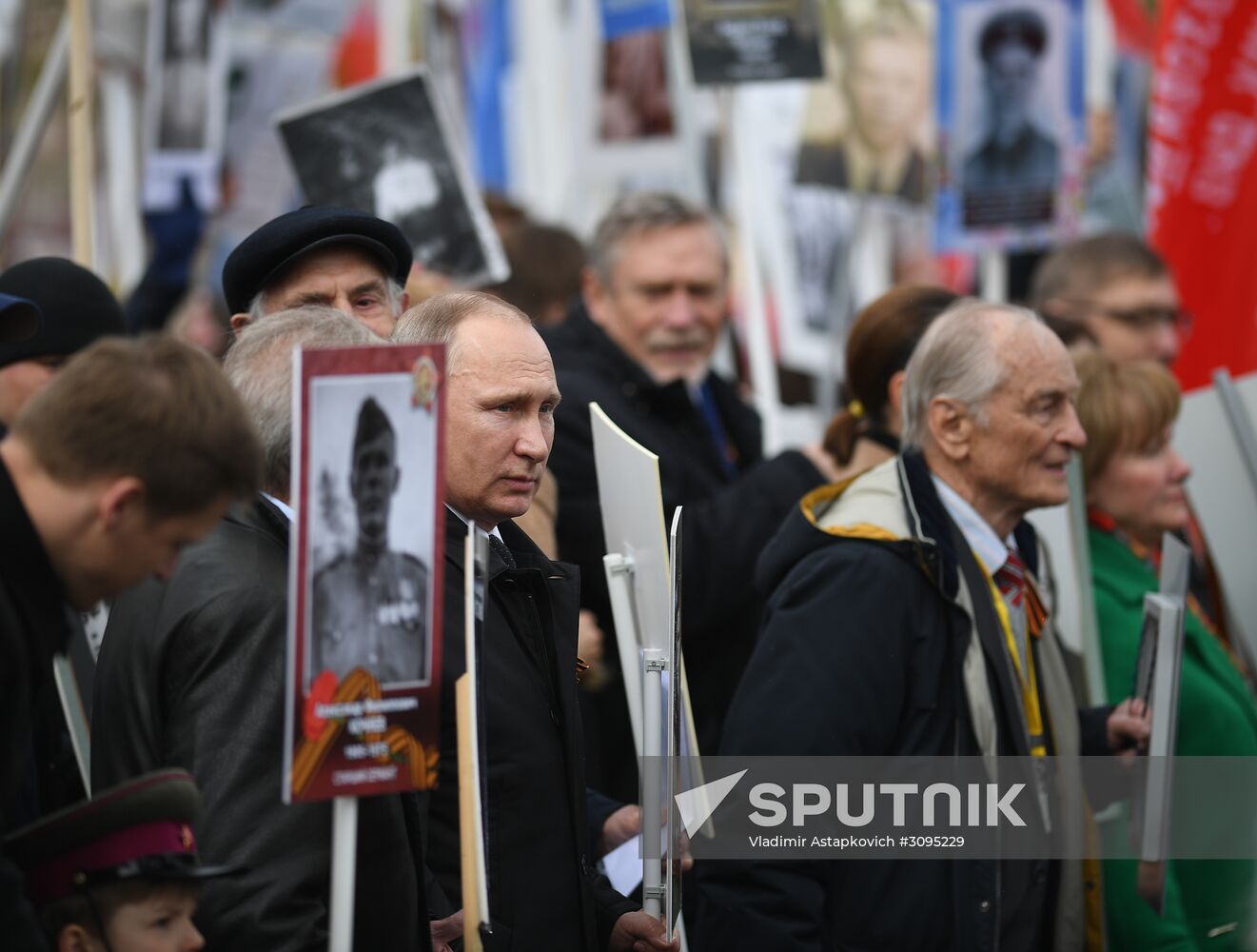 Russian President Vladimir Putin takes part in Immortal Regiment march