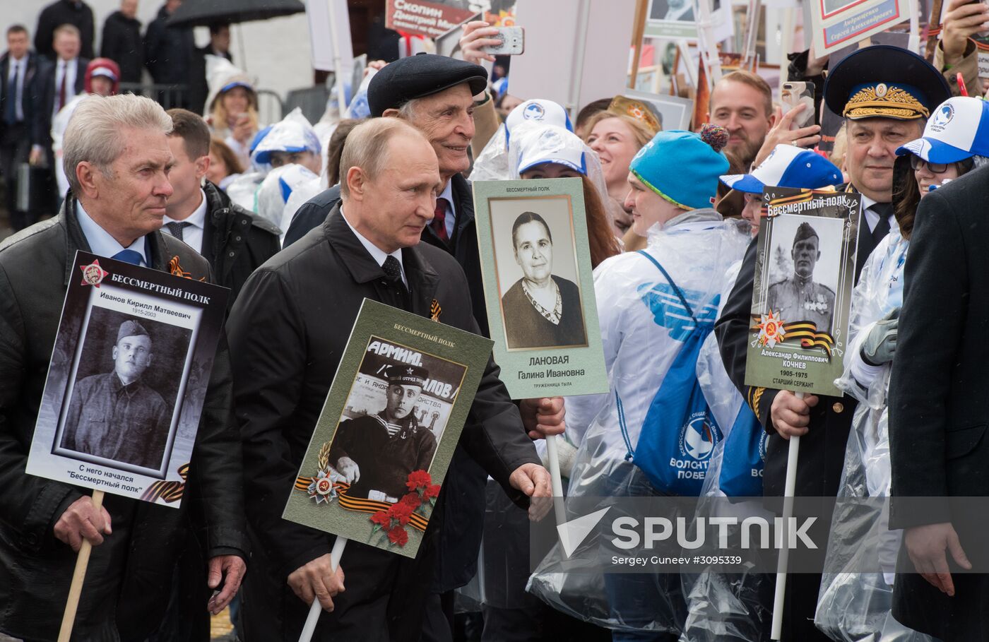 Russian President Vladimir Putin takes part in Immortal Regiment march