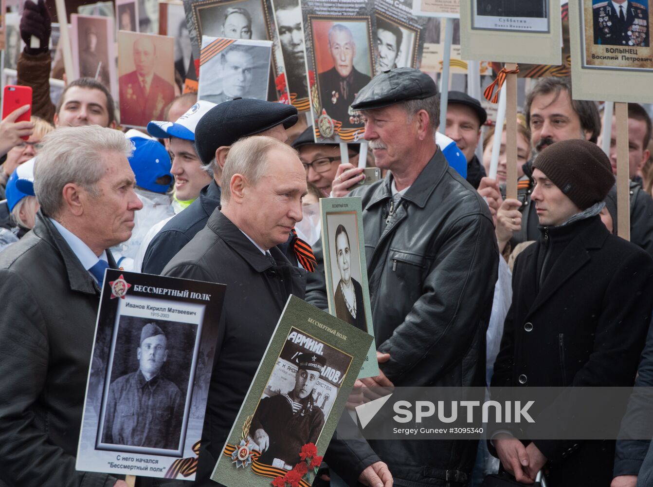 Russian President Vladimir Putin takes part in Immortal Regiment march