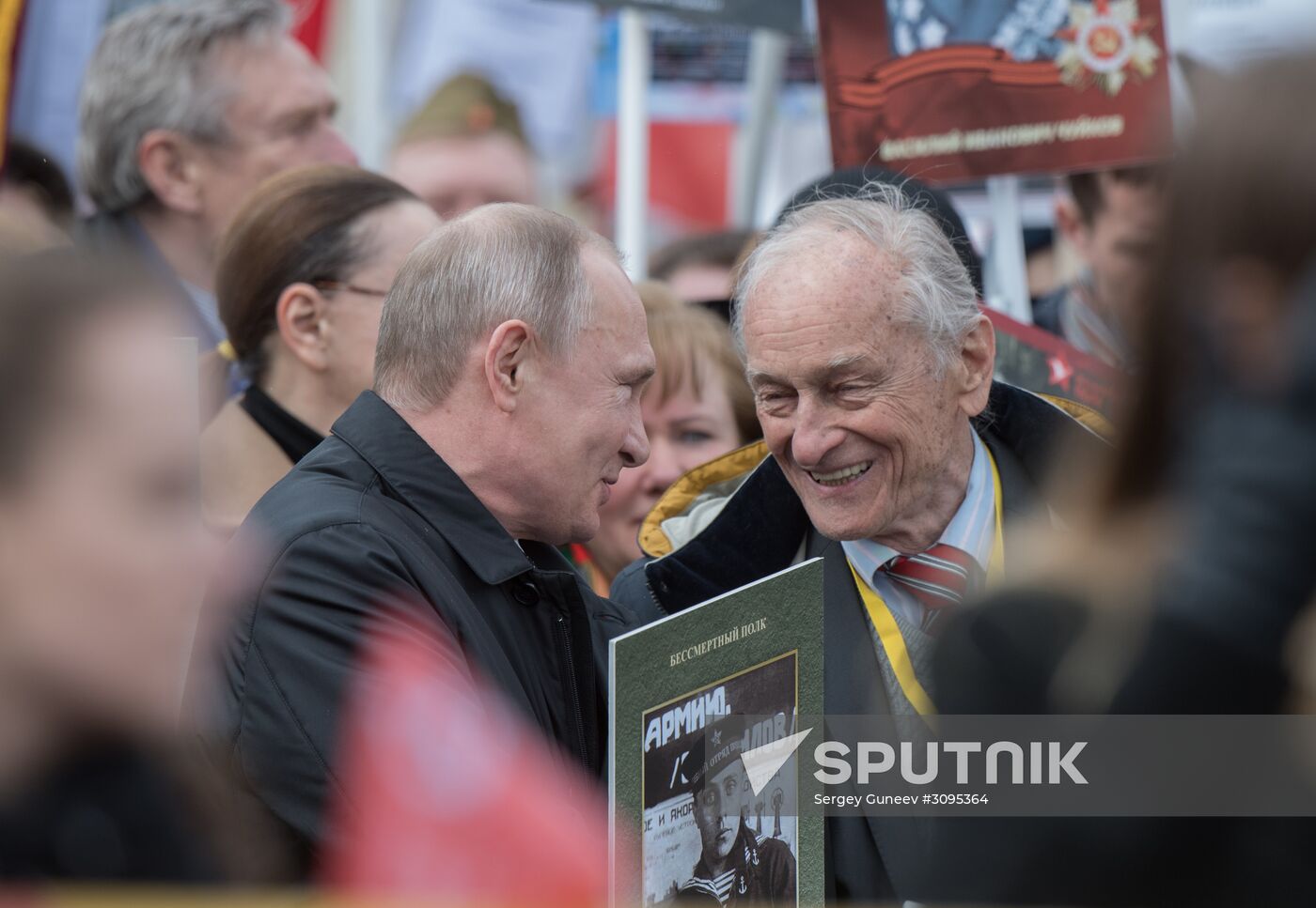 Russian President Vladimir Putin takes part in Immortal Regiment march