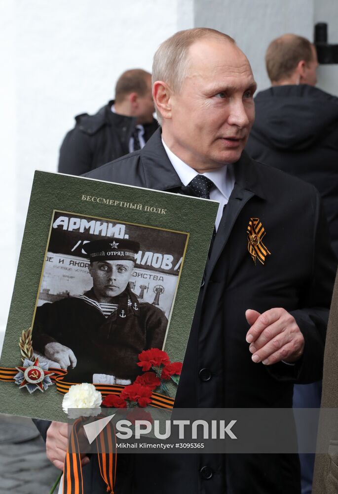 Russian President Vladimir Putin takes part in Immortal Regiment march