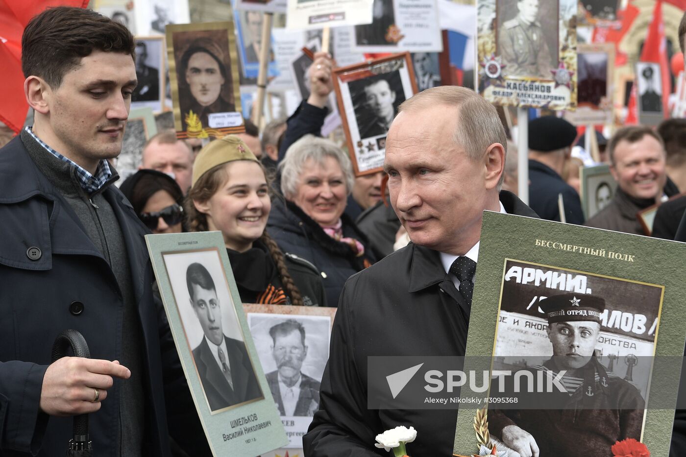 Russian President Vladimir Putin takes part in Immortal Regiment march