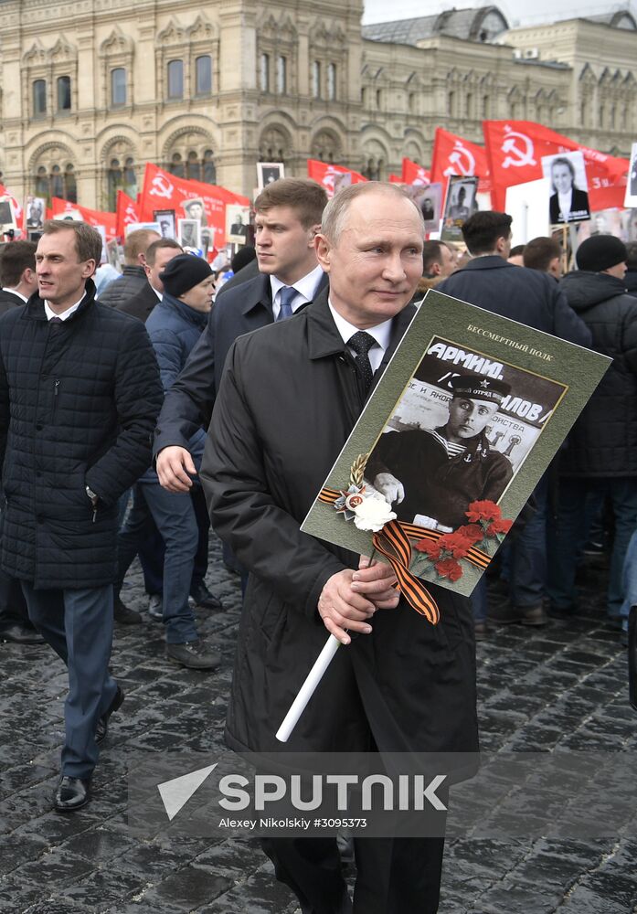 Russian President Vladimir Putin takes part in Immortal Regiment march