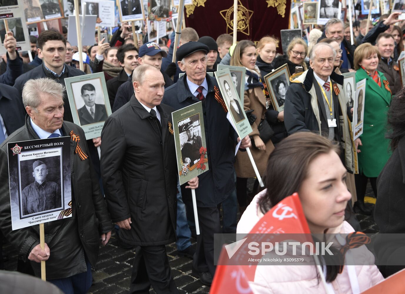 Russian President Vladimir Putin takes part in Immortal Regiment march