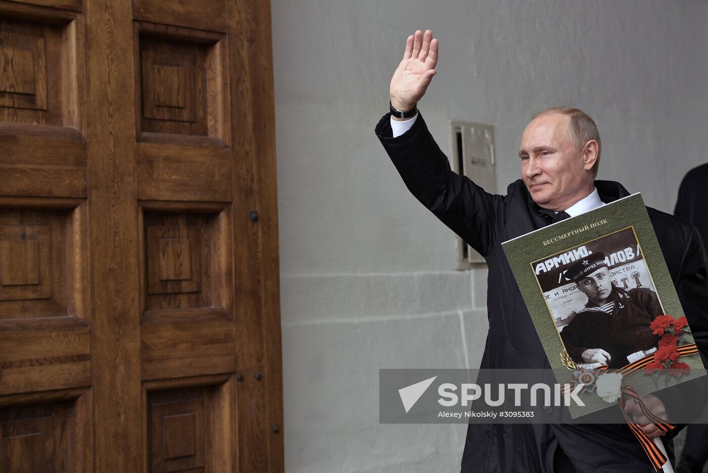 Russian President Vladimir Putin takes part in Immortal Regiment march