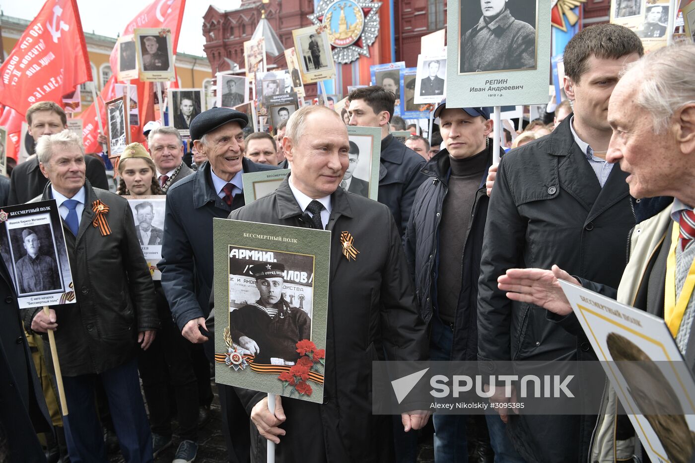 Russian President Vladimir Putin takes part in Immortal Regiment march