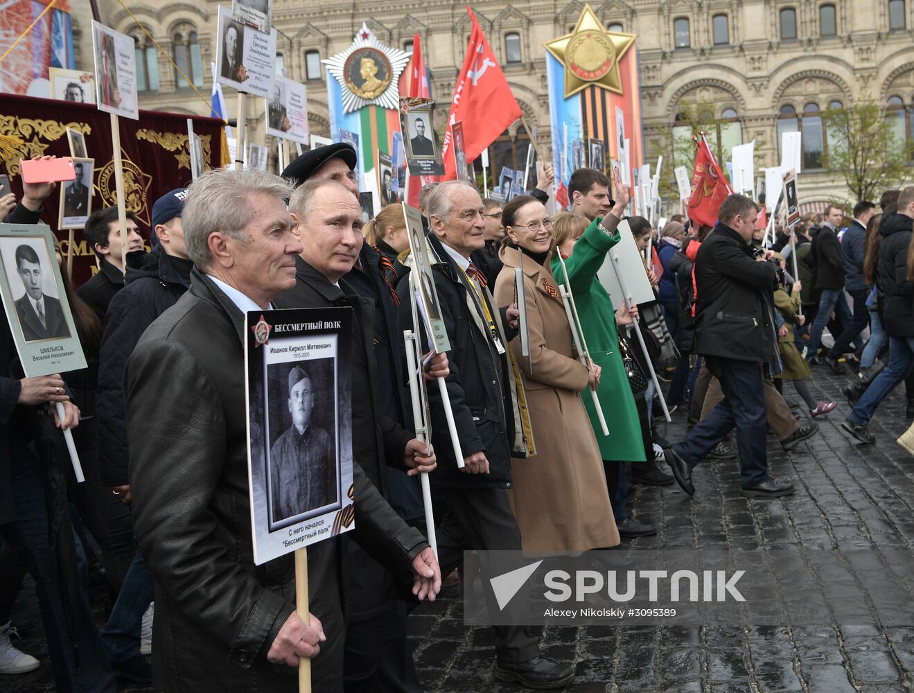 Russian President Vladimir Putin takes part in Immortal Regiment march