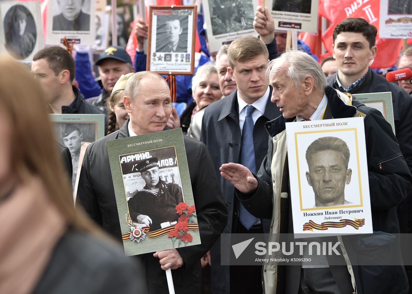 Russian President Vladimir Putin takes part in Immortal Regiment march
