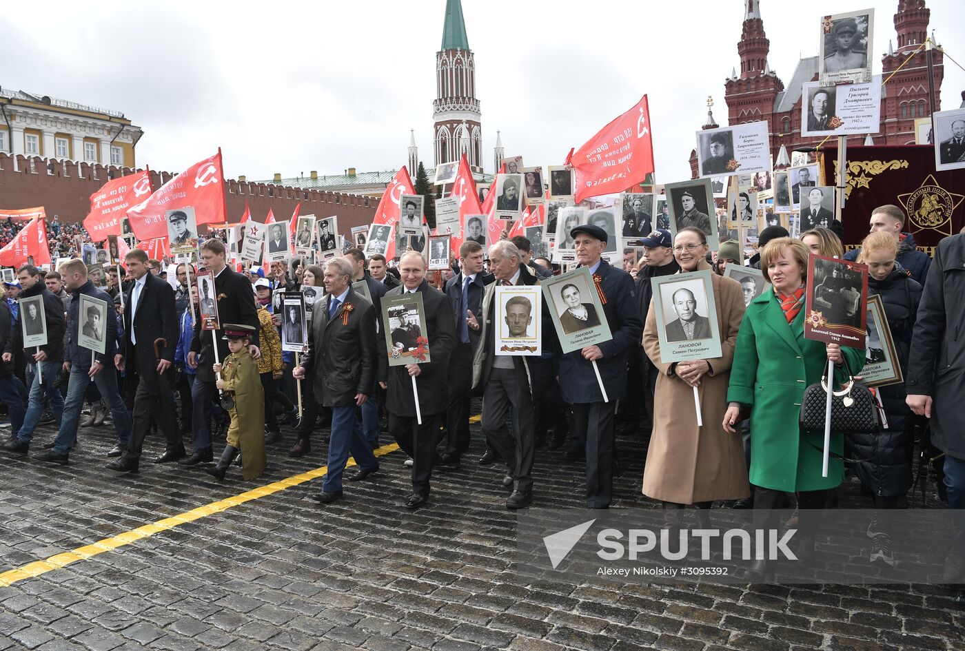 Russian President Vladimir Putin takes part in Immortal Regiment march