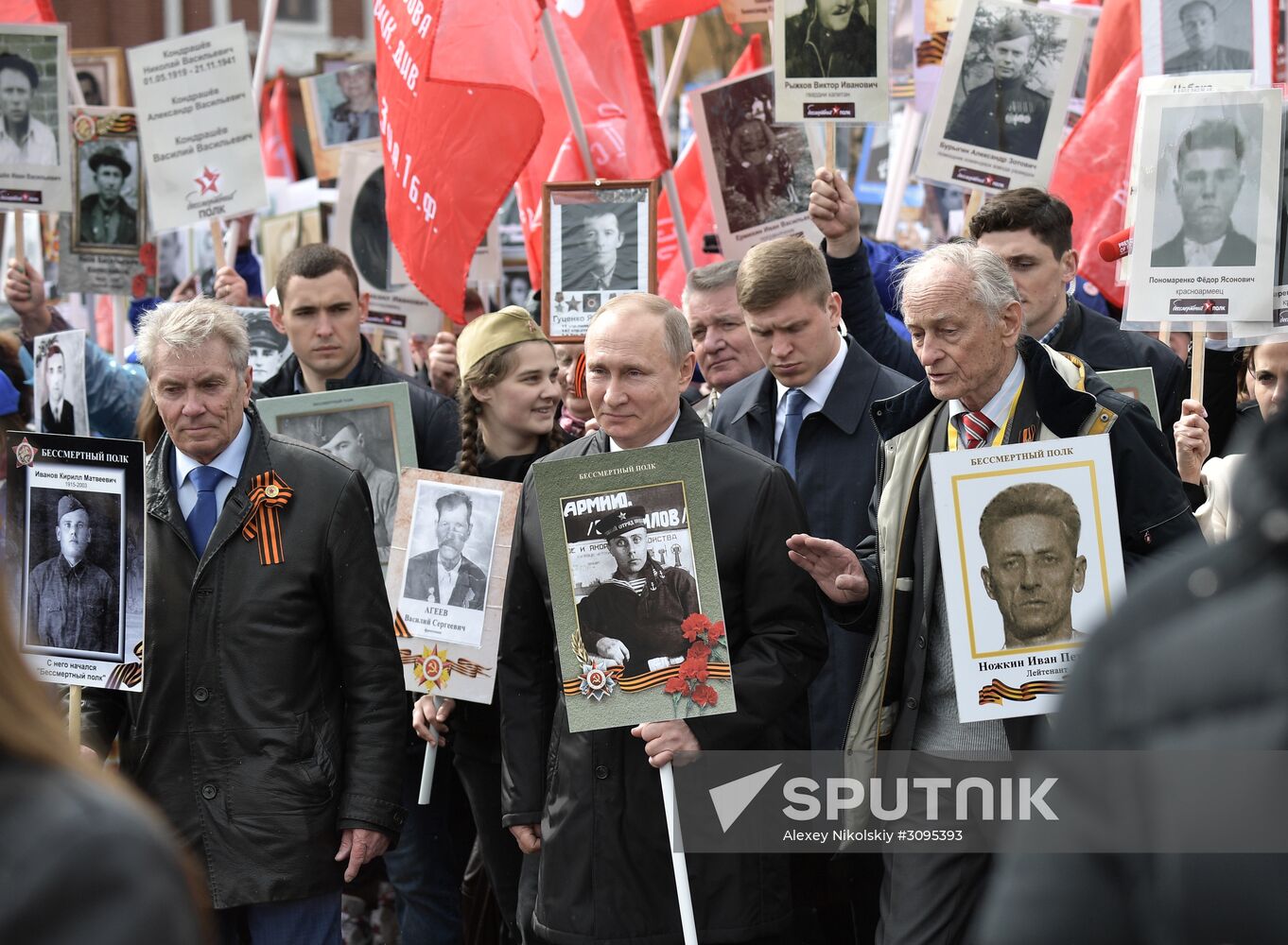 Russian President Vladimir Putin takes part in Immortal Regiment march