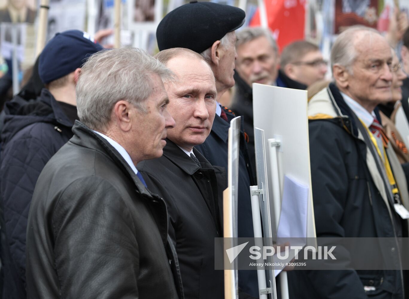 Russian President Vladimir Putin takes part in Immortal Regiment march