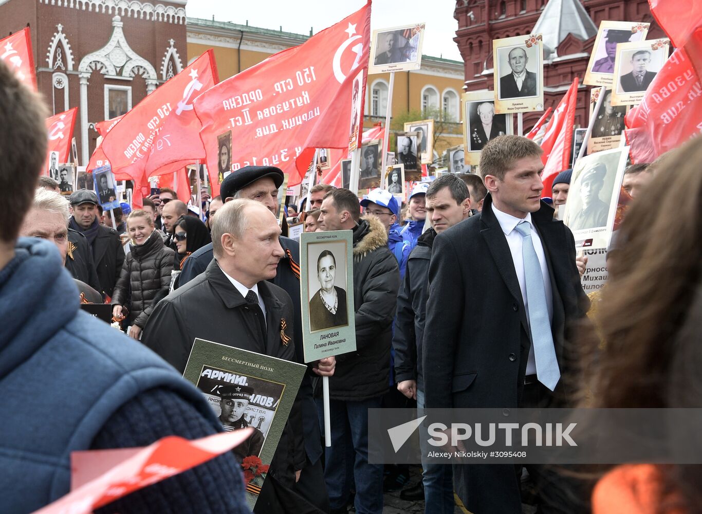 Russian President Vladimir Putin takes part in Immortal Regiment march