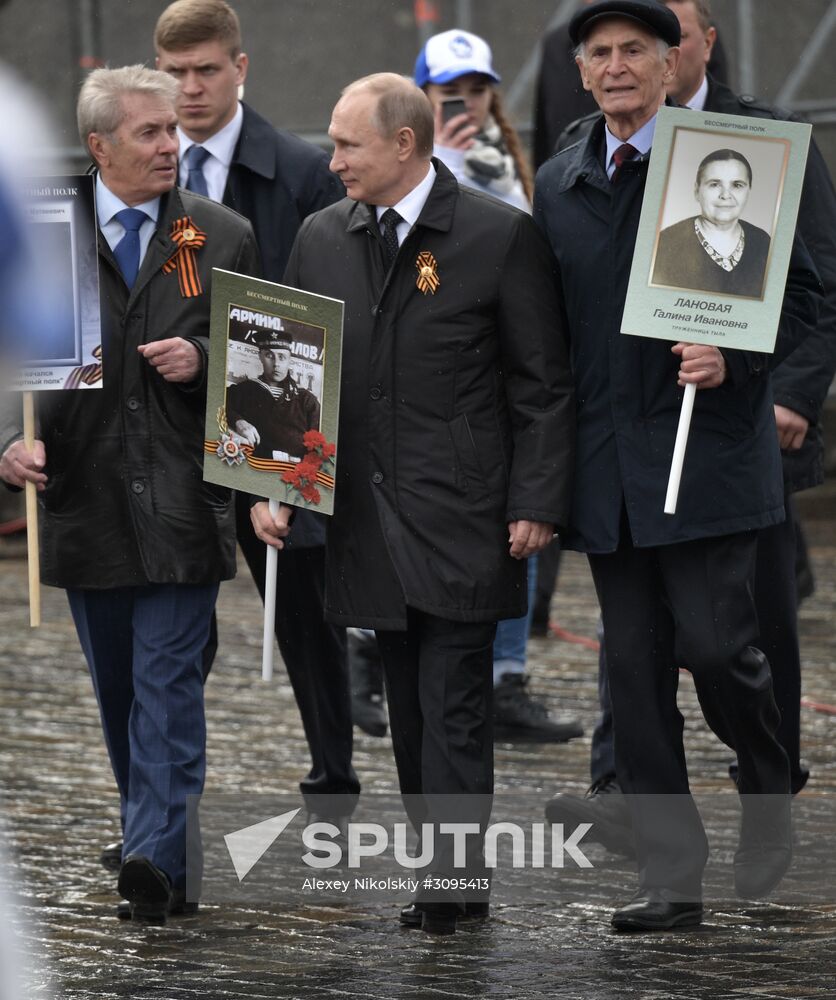 Russian President Vladimir Putin takes part in Immortal Regiment march