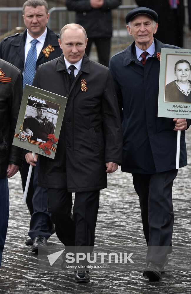 Russian President Vladimir Putin takes part in Immortal Regiment march
