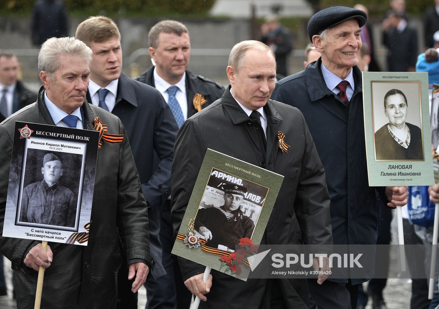 Russian President Vladimir Putin takes part in Immortal Regiment march