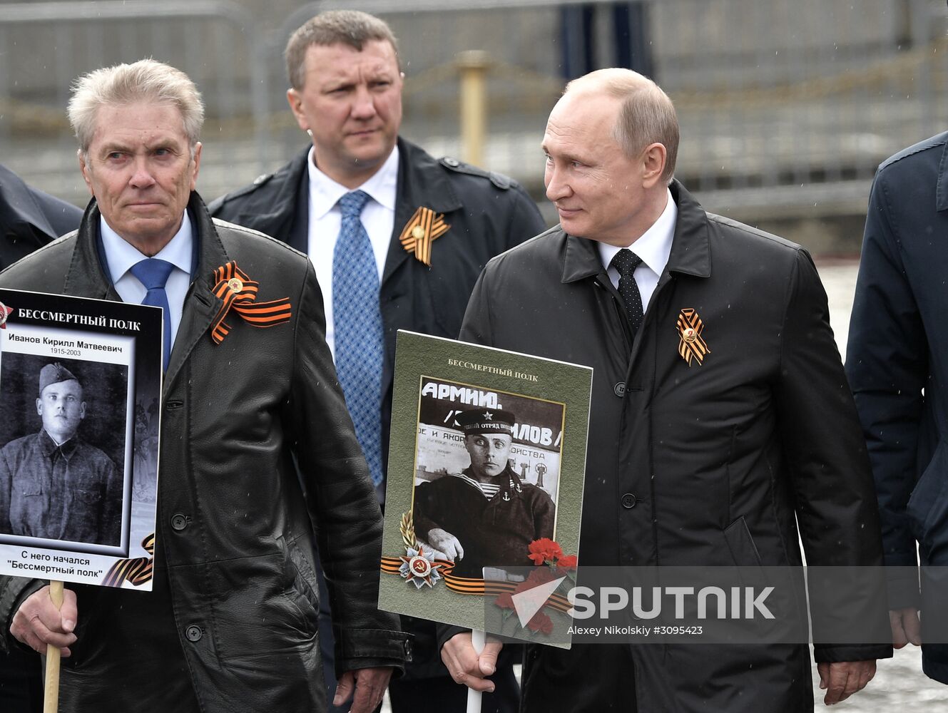 Russian President Vladimir Putin takes part in Immortal Regiment march