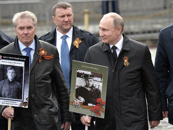 Russian President Vladimir Putin takes part in Immortal Regiment march
